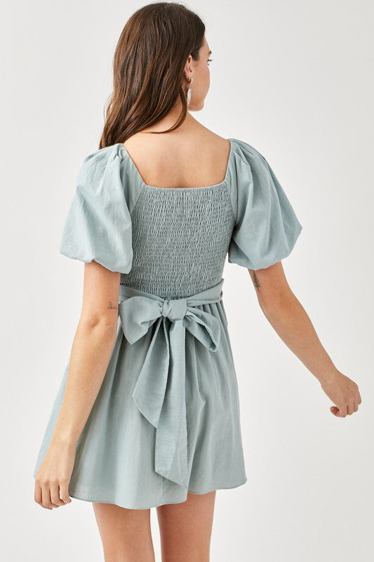 CARLINE CROSS WRAP SMOCKED BACK DRESS